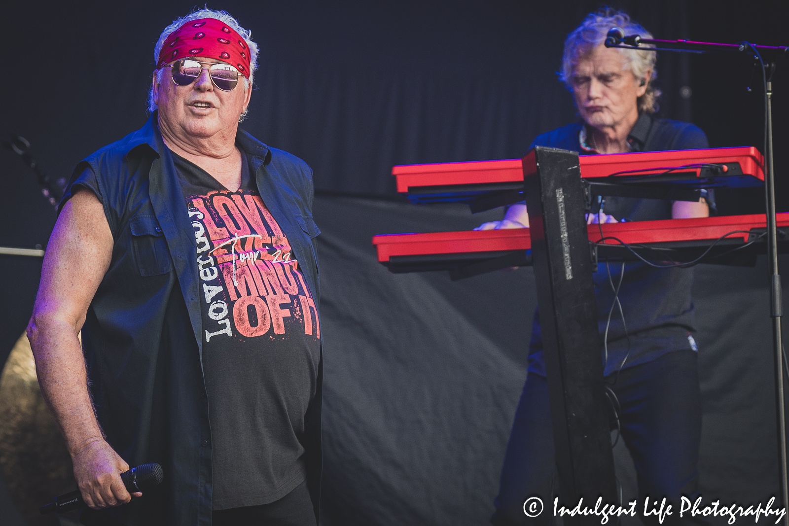 Loverboy lead singer Mike Reno and keyboardist Doug Johnson performing together at Starlight Theatre in Kansas City, MO on July 18, 2023.