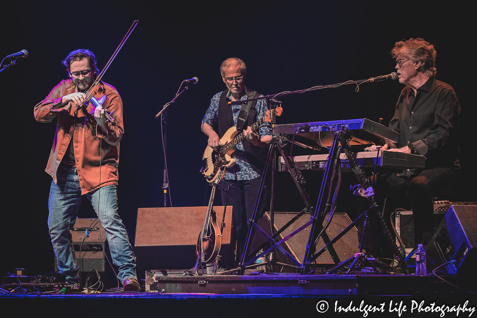 Nitty Gritty Dirt Band members Ross Holmes, Jim Photoglo and Bob Carpenter performing together at Ameristar Casino Hotel Kansas City on July 8, 2023.