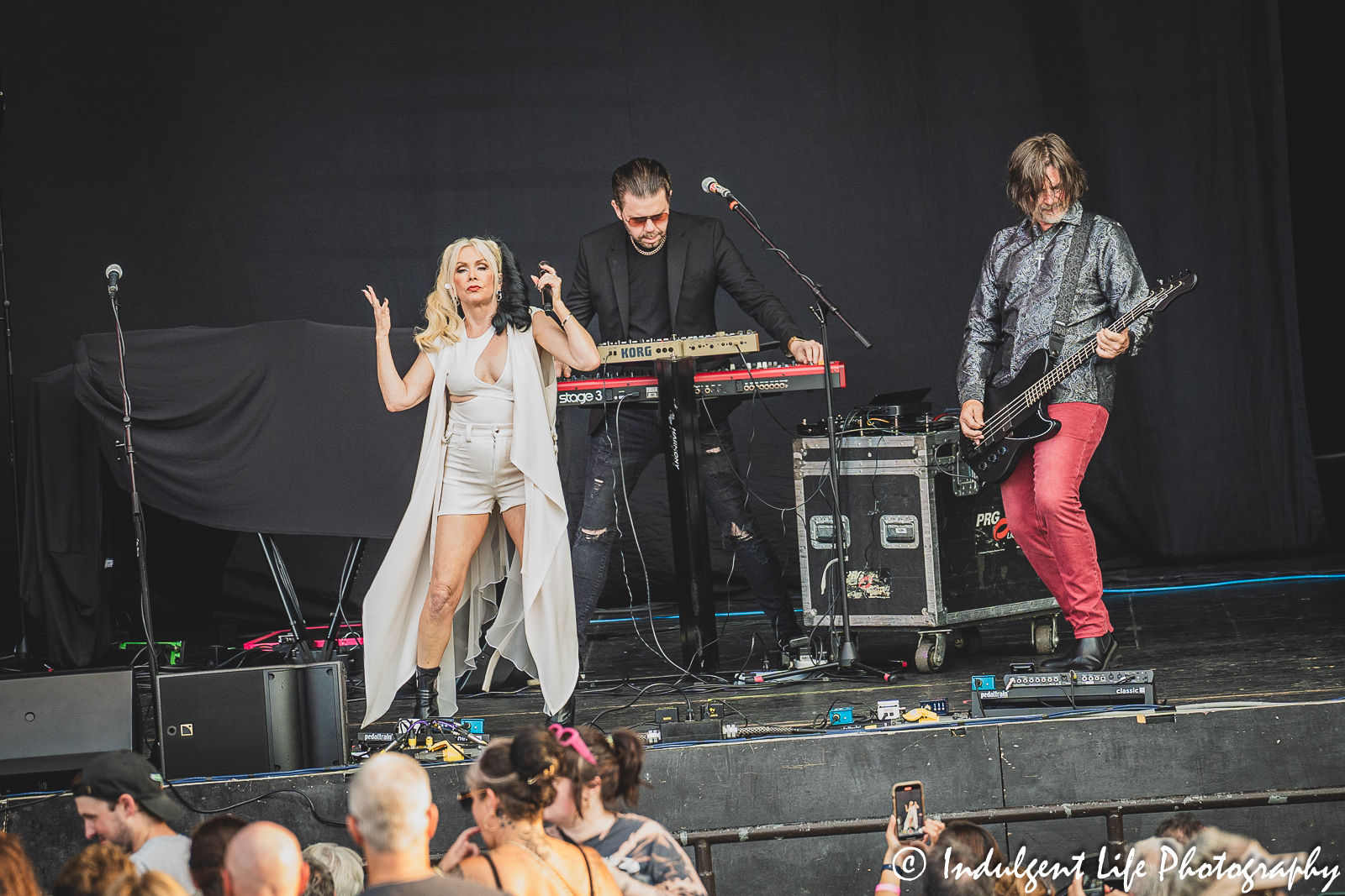 Berlin lead singer Terri Nunn with keyboard player Dave Schulz and bass guitarist John Crawford at Starlight Theatre in Kansas City, MO on August 8, 2023.