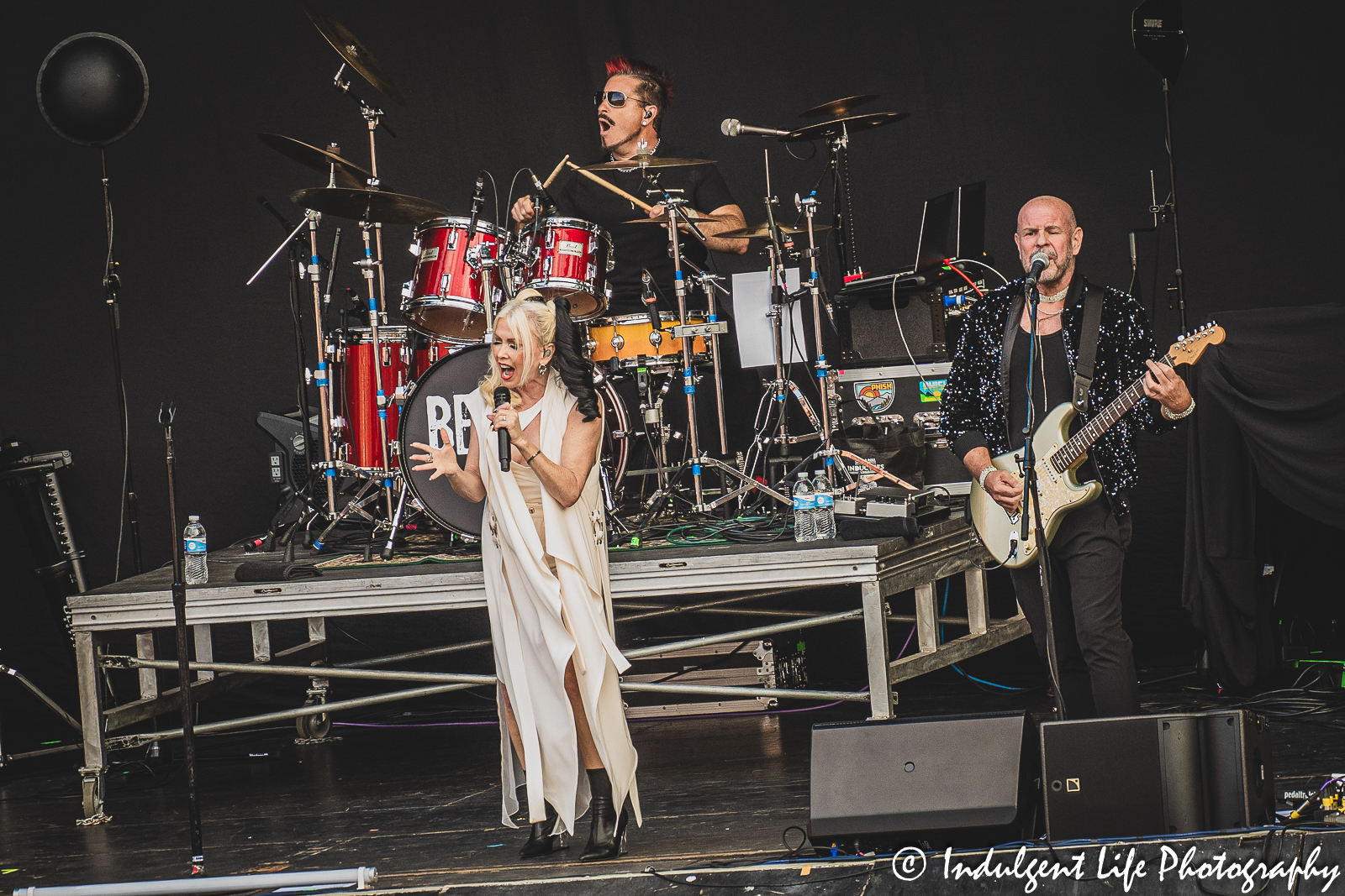 Lead singer Terri Nunn of Berlin with drummer Ric "Rocc" Roccapriore and guitarist David Diamond at Starlight Theatre in Kansas City, MO on August 8, 2023.