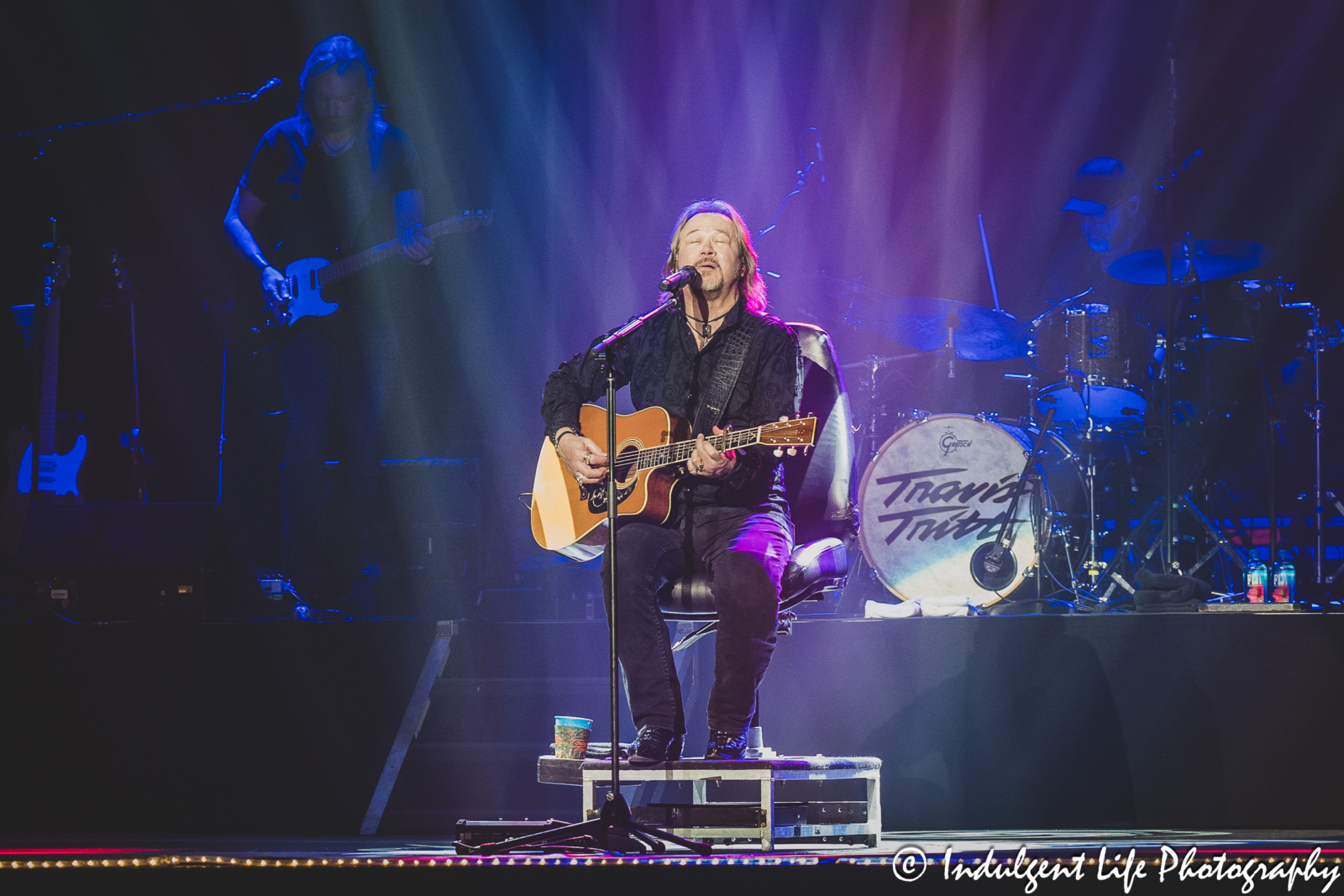 Travis Tritt playing the acoustic guitar during a live performance at Ameristar Casino's Star Pavilion in Kansas City, MO on September 16, 2023.