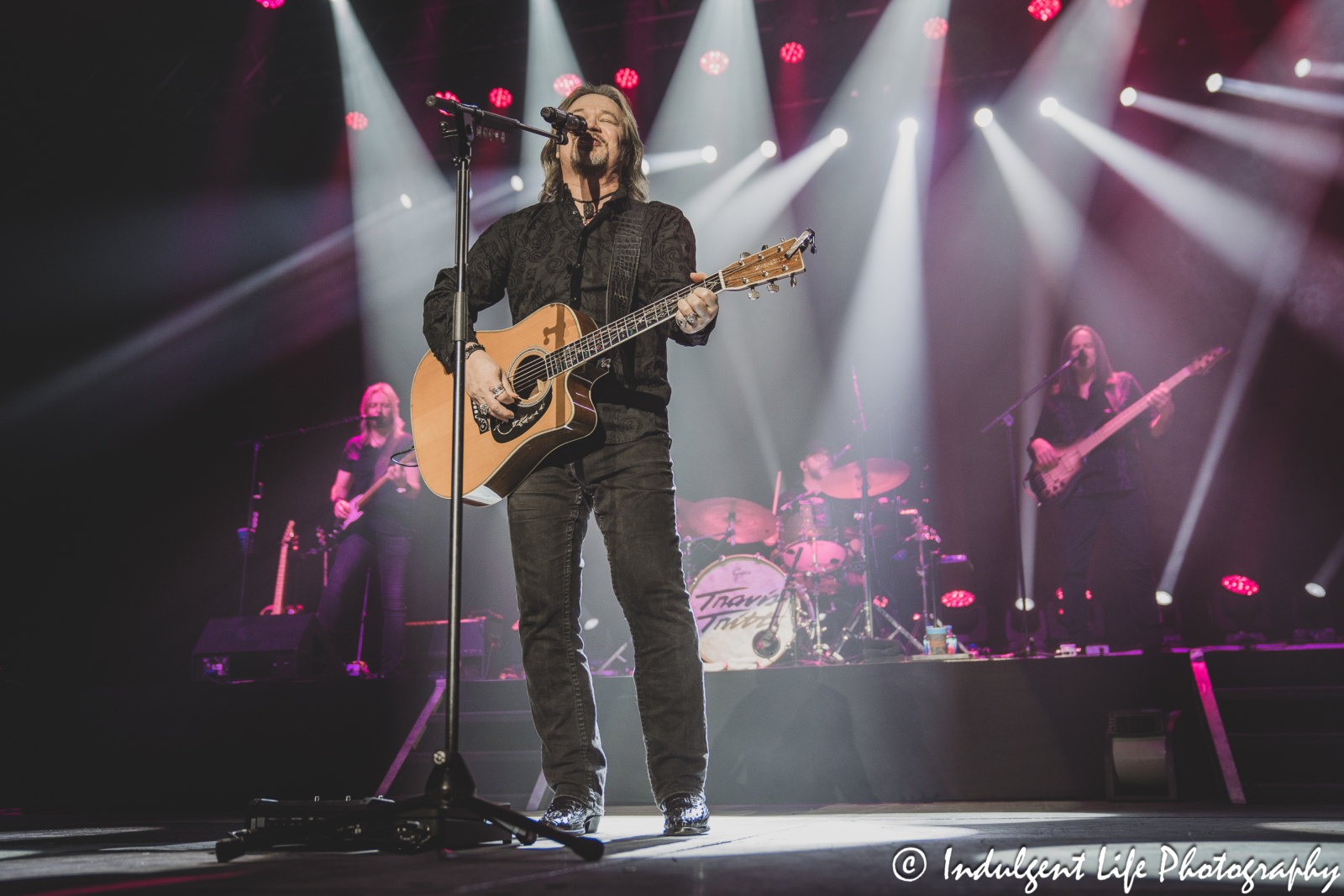 Travis singing and playing the acoustic guitar during a live performance at Ameristar Casino Hotel Kansas City on September 16, 2023.