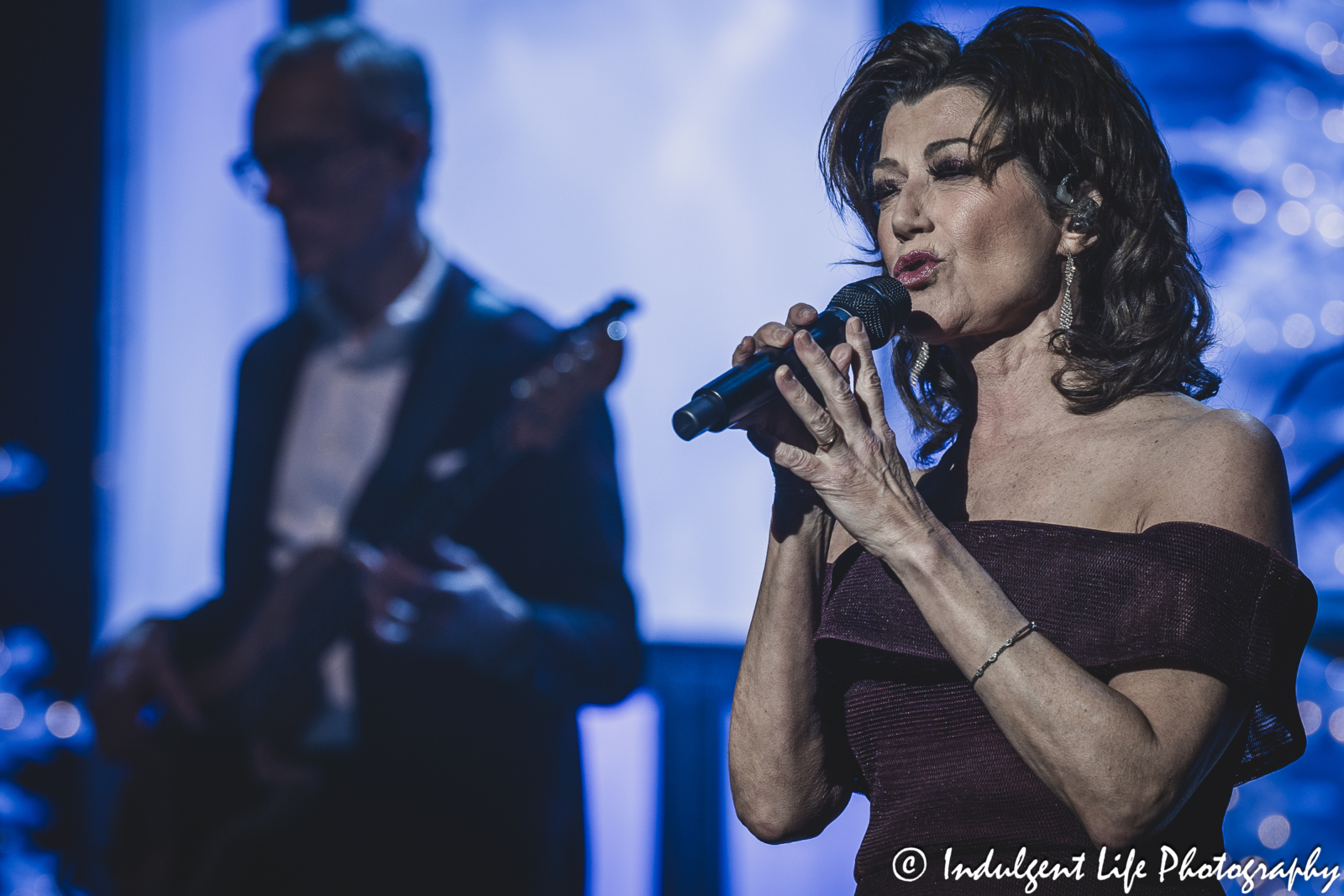 Amy Grant performing live with her guitarist during her Christmas concert at Music Hall in downtown Kansas City, MO on November 30, 2023.