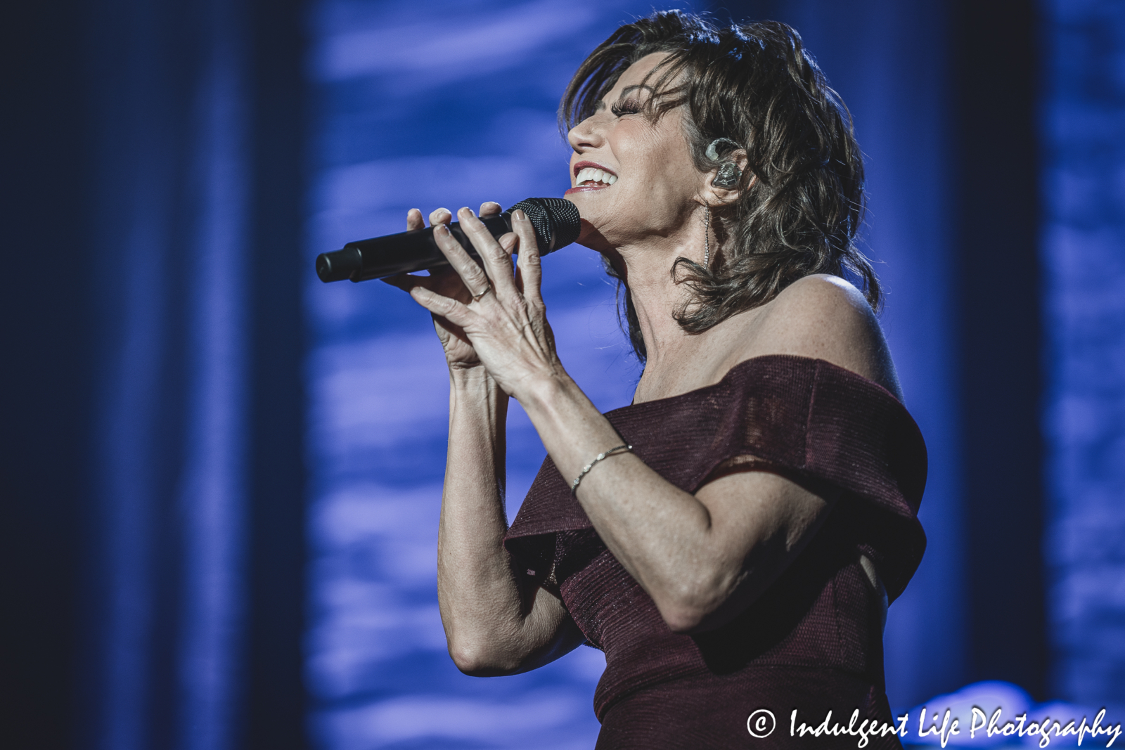 Amy Grant singing live during her Christmas show concert at Music Hall in downtown Kansas City, MO on November 30, 2023.