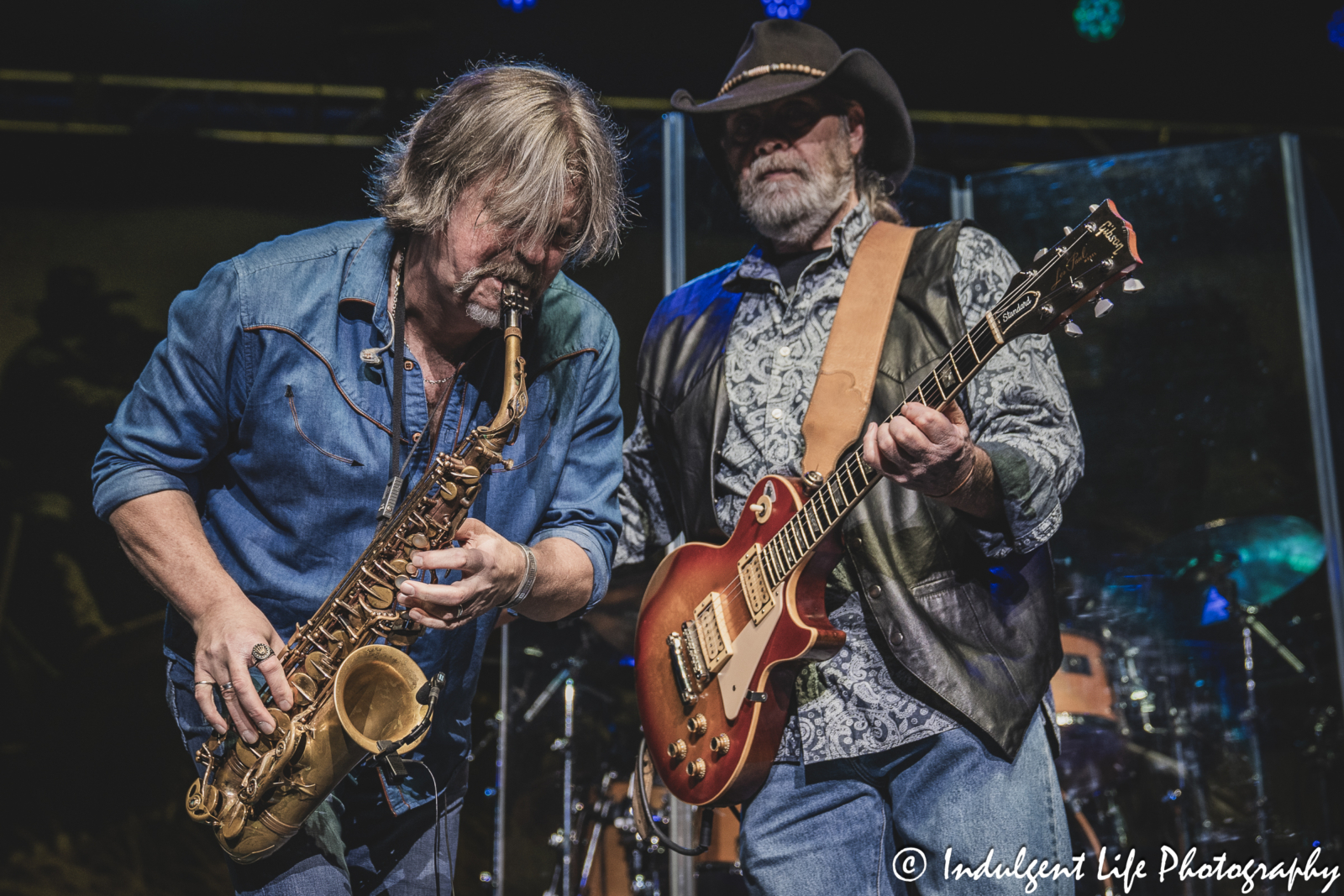 Saxophone player Marcus James Henderson and guitarist Rick Willis of The Marshall Tucker Band performing together at Ameristar Casino in Kansas City, MO on December 1, 2023
