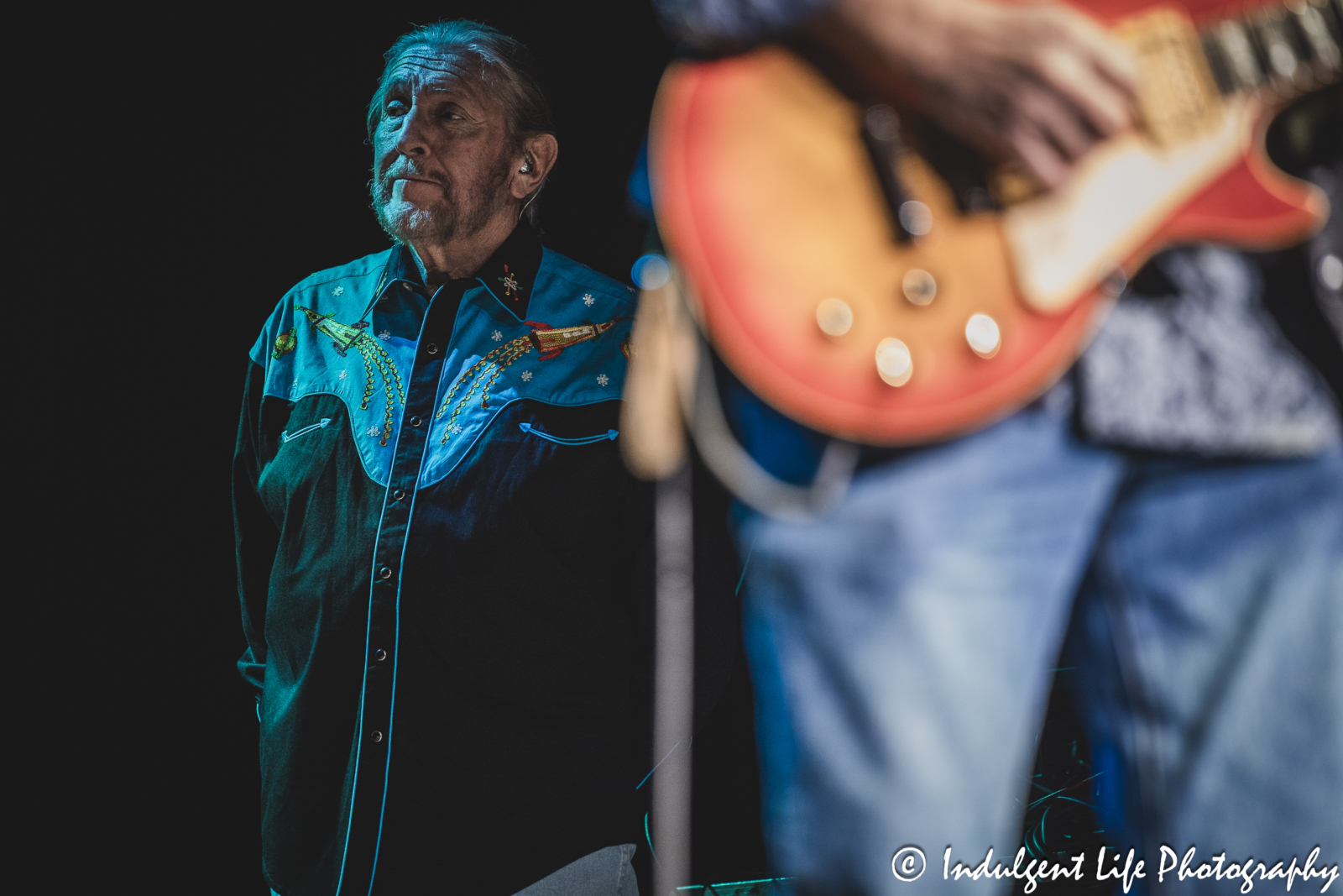 Frontman and founding member Doug Gray of The Marshall Tucker Band watching on as his group members perform live at Ameristar Casino Hotel Kansas City on December 1, 2023.
