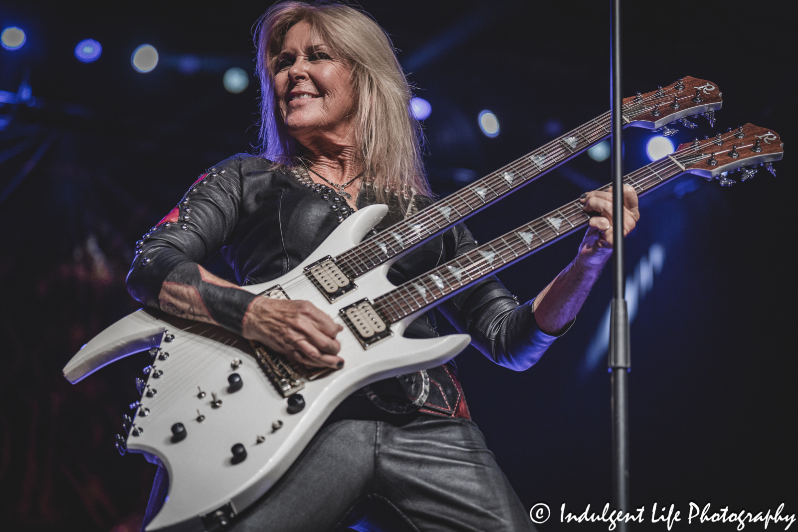 Lita Ford playing her double-headed guitar live at Hy-Vee Arena in Kansas City, MO on March 22, 2024.