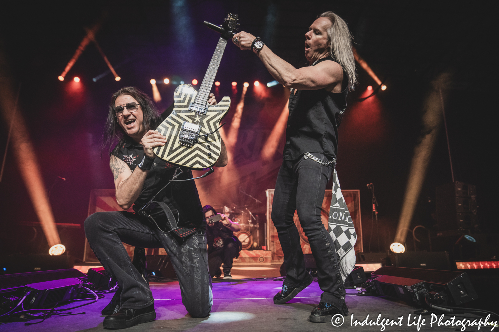 Warrant guitarist Erik Turner and lead singer Robert Mason live in concert at Hy-Vee Arena in Kansas City, MO on March 22, 2024.