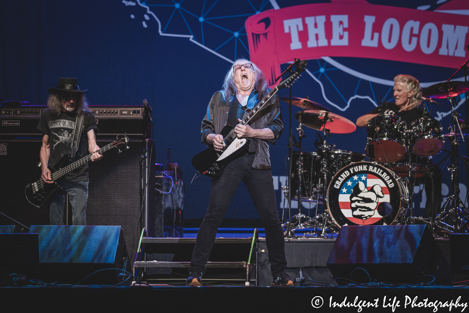 Grand Funk Railroad guitarist Mark Chatfield performing with bass player Mel Schacher and drummer Don Brewer at Ameristar Casino in Kansas City, MO on June 21, 2024.