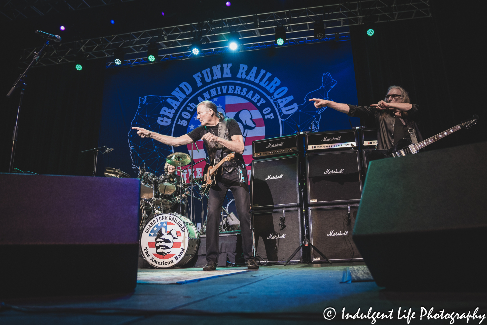 Drummer Don Brewer, frontman Max Carl and guitarist Mark Chatfield of Grand Funk Railroad live in concert together at Ameristar Casino in Kansas City, MO on June 21, 2024.