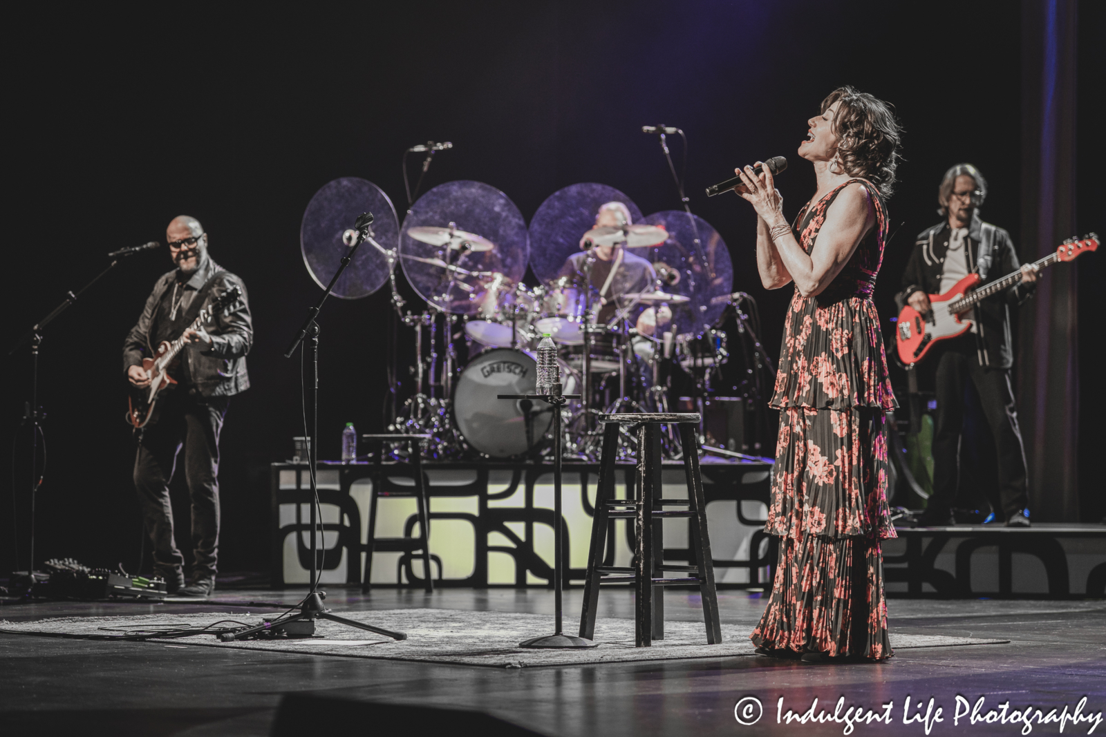 Amy Grant performing "Walk On Water" with guitarist Gene Miller, drummer John Hammond and bass player Mike Brignardello at Kauffman Center in downtown Kansas City, MO on April 4, 2025.