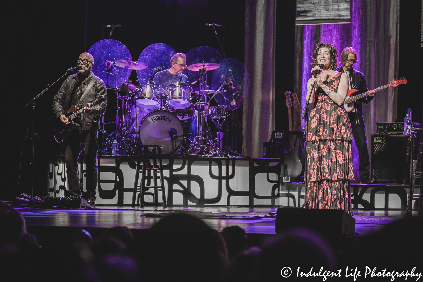 Amy Grant performing the chart-topping song "Stay for Awhile" with guitarist Gene Miller, drummer John Hammond and bass player Mike Brignardello at Kauffman Center in downtown Kansas City, MO on April 4, 2025.