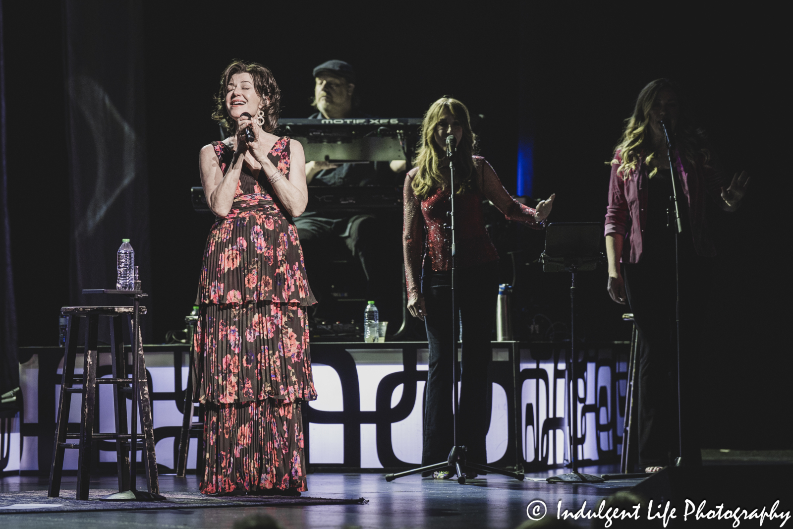 Amy Grant performing "Shadows" with her keyboard player Jonathan Hardy and backup singers Kim Keyes and Tatiana Hazel at Kauffman Center in downtown Kansas City, MO on April 4, 2025.