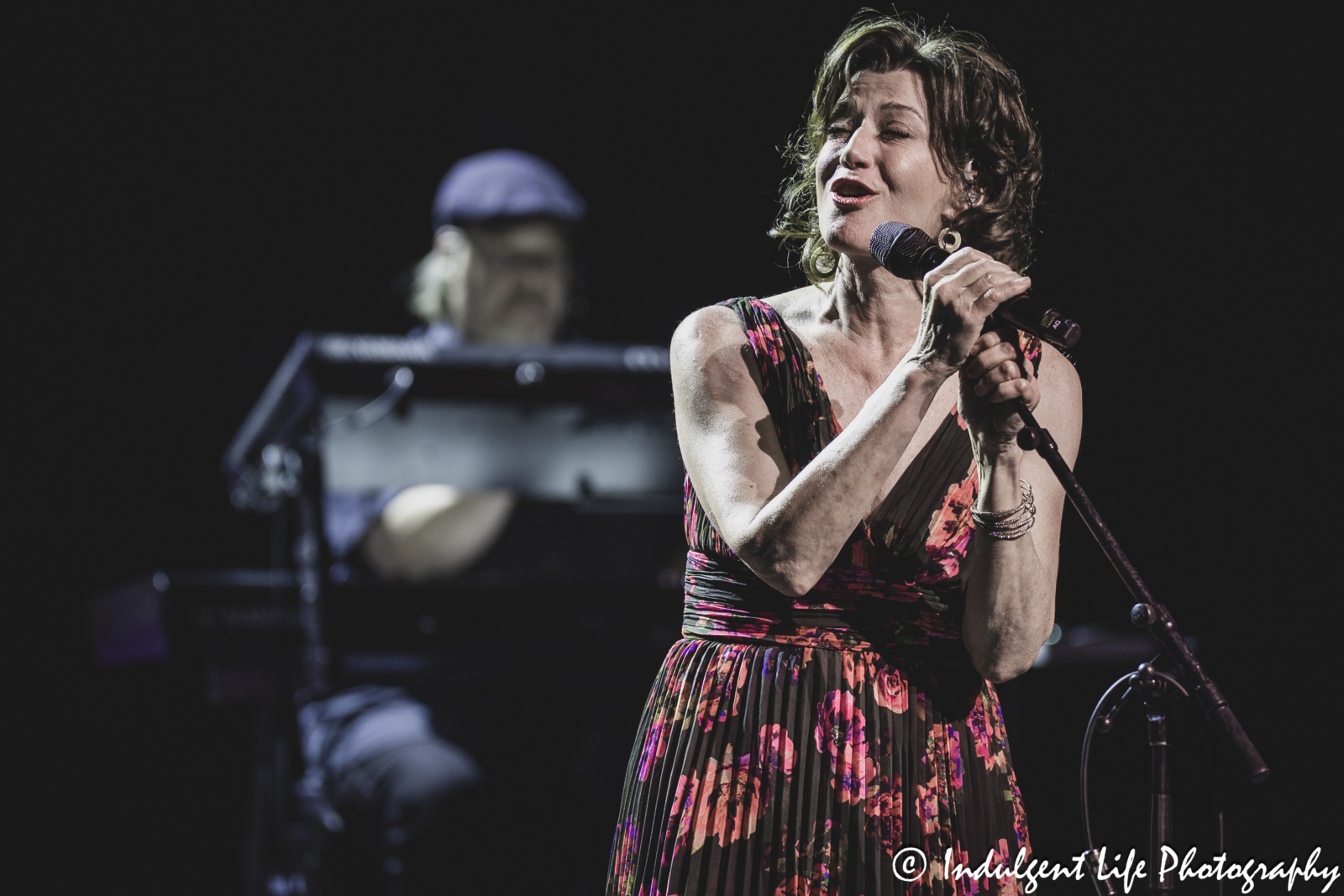 Amy Grant and keyboardist Jonathan Hardy performing "Shadows" together at Kauffman Center in downtown Kansas City, MO on April 4, 2025.