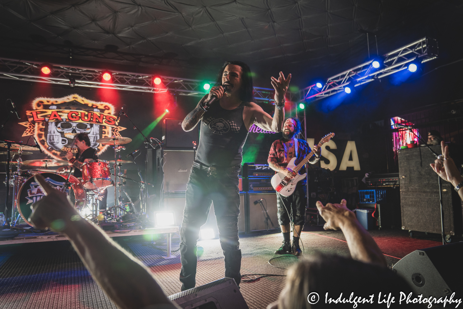 Lead singer Phil Lewis, drummer Shawn Duncan and guitarist Tracii Guns of L.A. Guns live in concert together at Knuckleheads Saloon in Kansas City, MO on May 22, 2025.