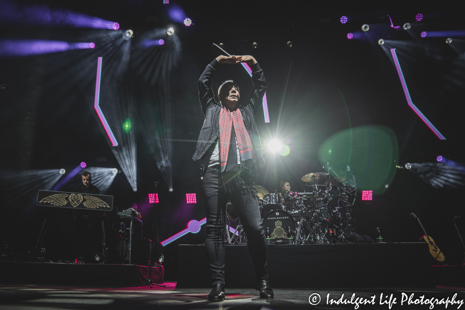 Lead singer Jim Kerr and his band Simple Minds performing "I Travel" live in concert on the band's "Alive & Kicking" tour at Hollywood Casino Amphitheater in Maryland Heights, MO on June 5, 2025.