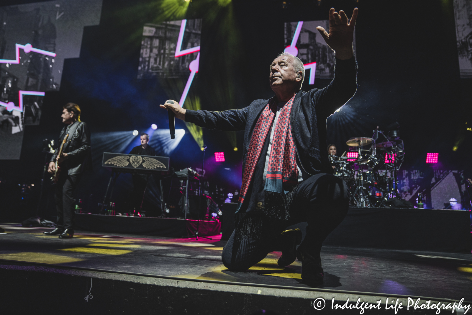Simple Minds frontman Jim Kerr performing "I Travel" live in concert on their "Alive & Kicking" tour at Hollywood Casino Amphitheater in Maryland Heights, MO on June 5, 2025.