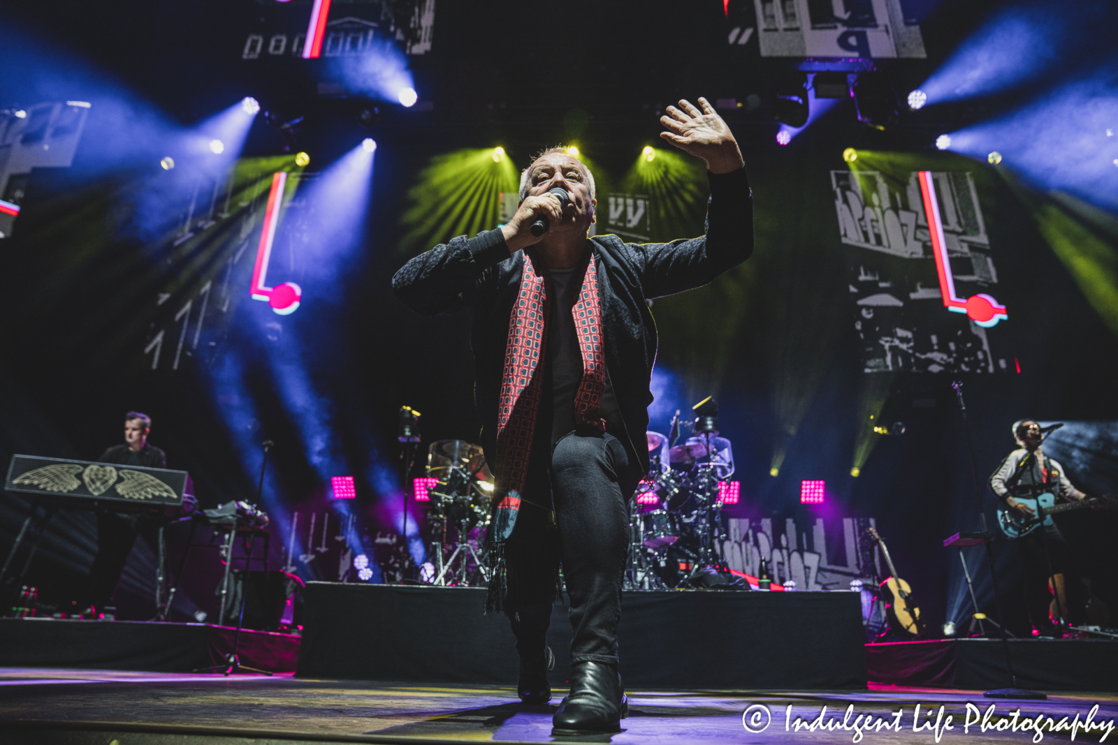 Simple Minds lead singer Jim Kerr performing "I Travel" live in concert on their "Alive & Kicking" tour at Hollywood Casino Amphitheater in Maryland Heights, MO on June 5, 2025.