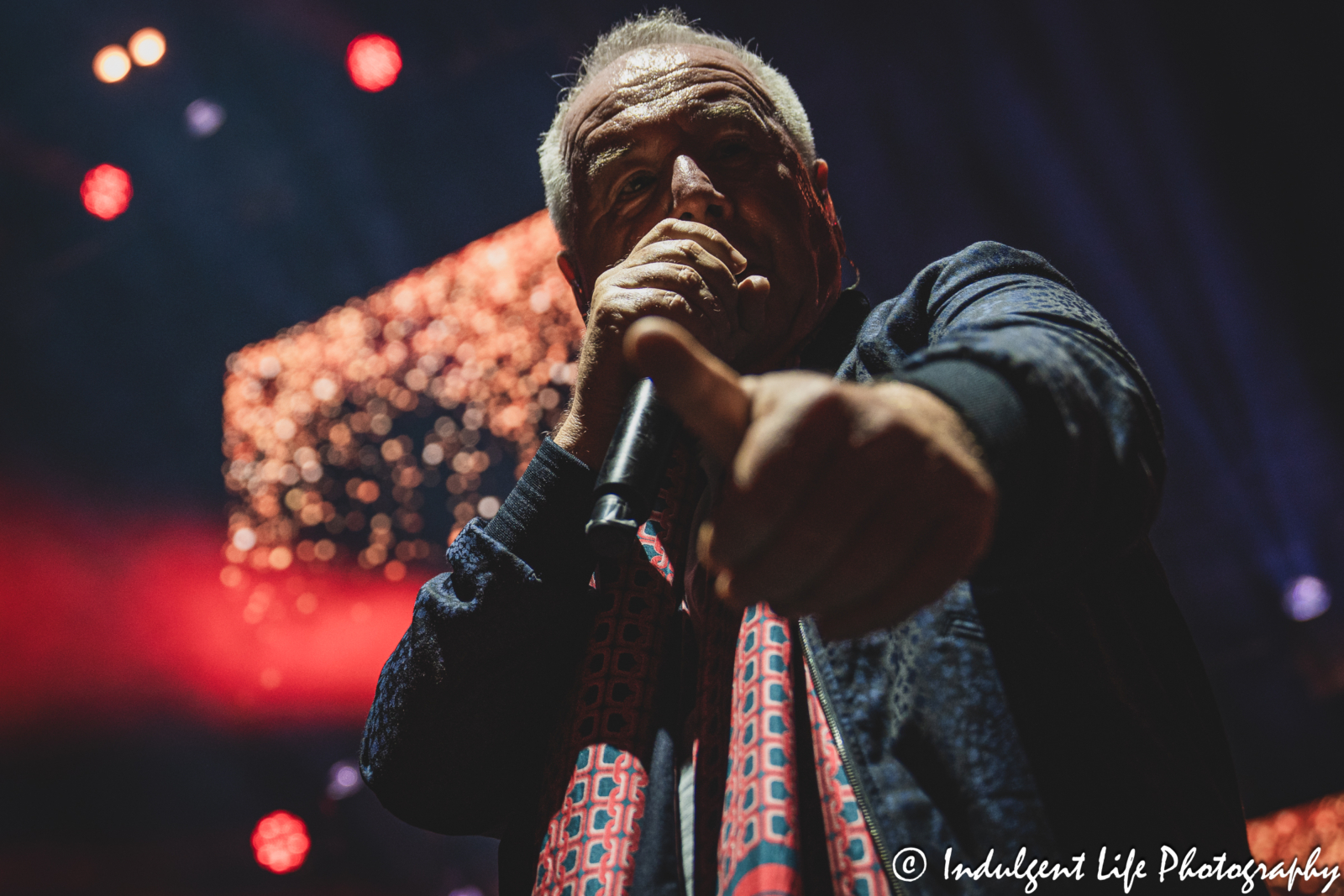 Simple Minds frontman Jim Kerr performing "Glittering Prize" live in concert on the band's "Alive & Kicking" tour at Hollywood Casino Amphitheater in Maryland Heights, MO on June 5, 2025.