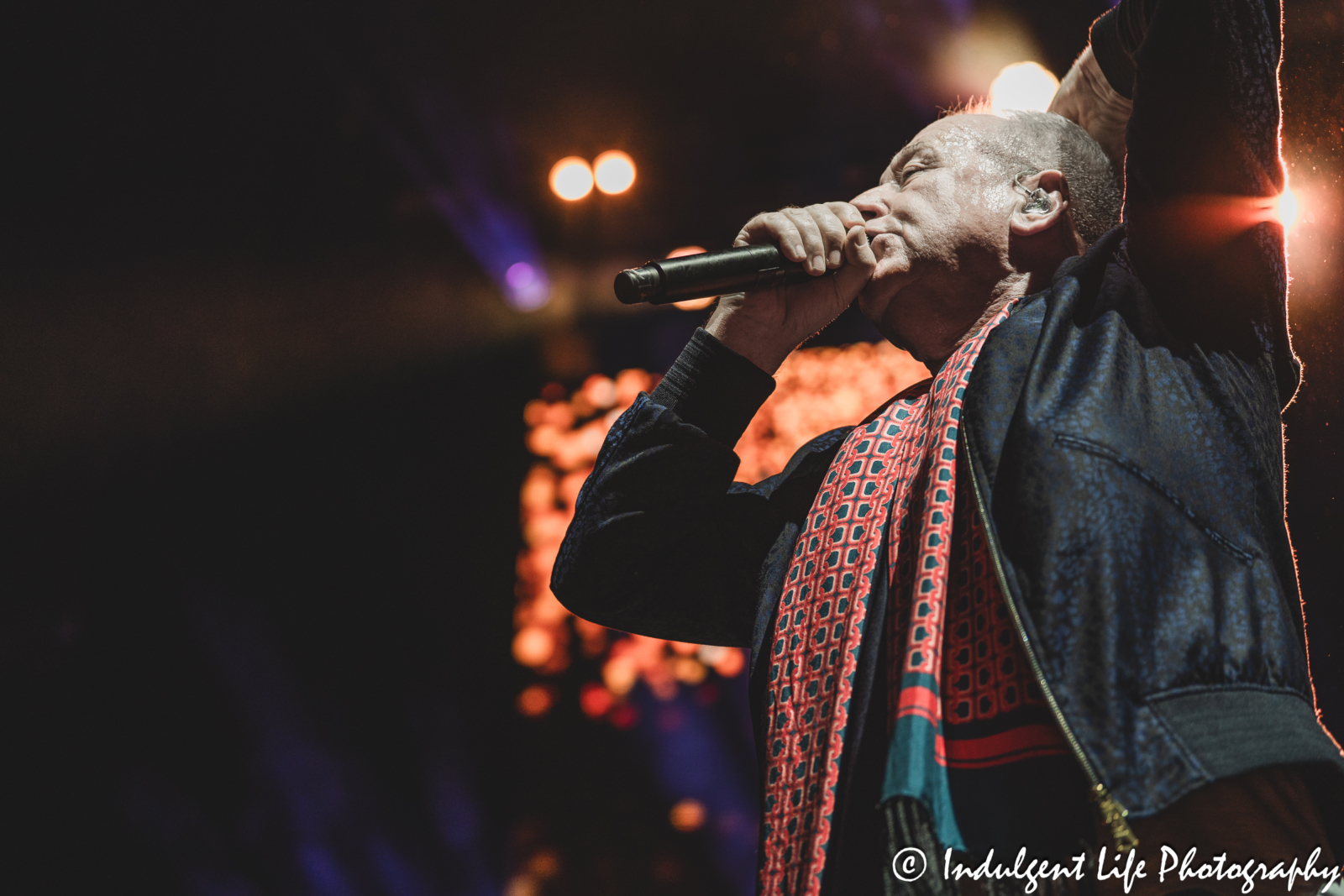 Lead singer Jim Kerr of Simple Minds performing "Glittering Prize" live in concert on the band's "Alive & Kicking" tour at Hollywood Casino Amphitheater in Maryland Heights, MO on June 5, 2025.