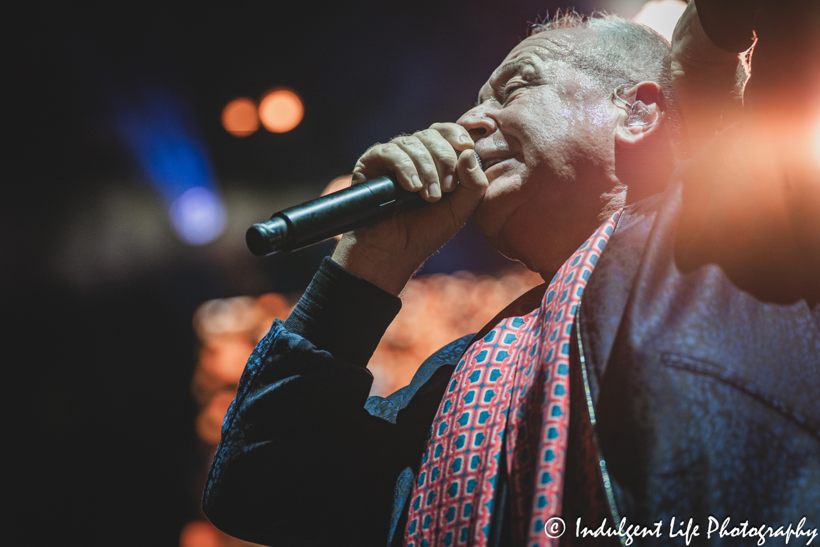 Simple Minds lead singer Jim Kerr performing "Glittering Prize" live in concert on the band's "Alive & Kicking" tour at Hollywood Casino Amphitheater in Maryland Heights, MO on June 5, 2025.