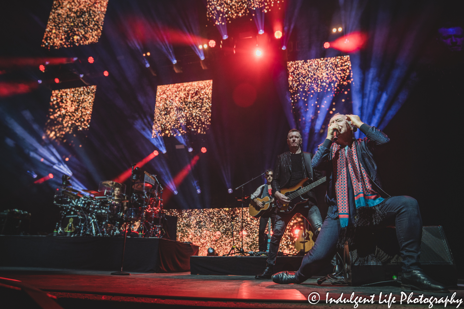 Lead singer Jim Kerr of Simple Minds performing "Glittering Prize" with Cherisse Osei, Ged Grimes and Gordy Goudie on the band's "Alive & Kicking" tour at Hollywood Casino Amphitheater in Maryland Heights, MO on June 5, 2025.