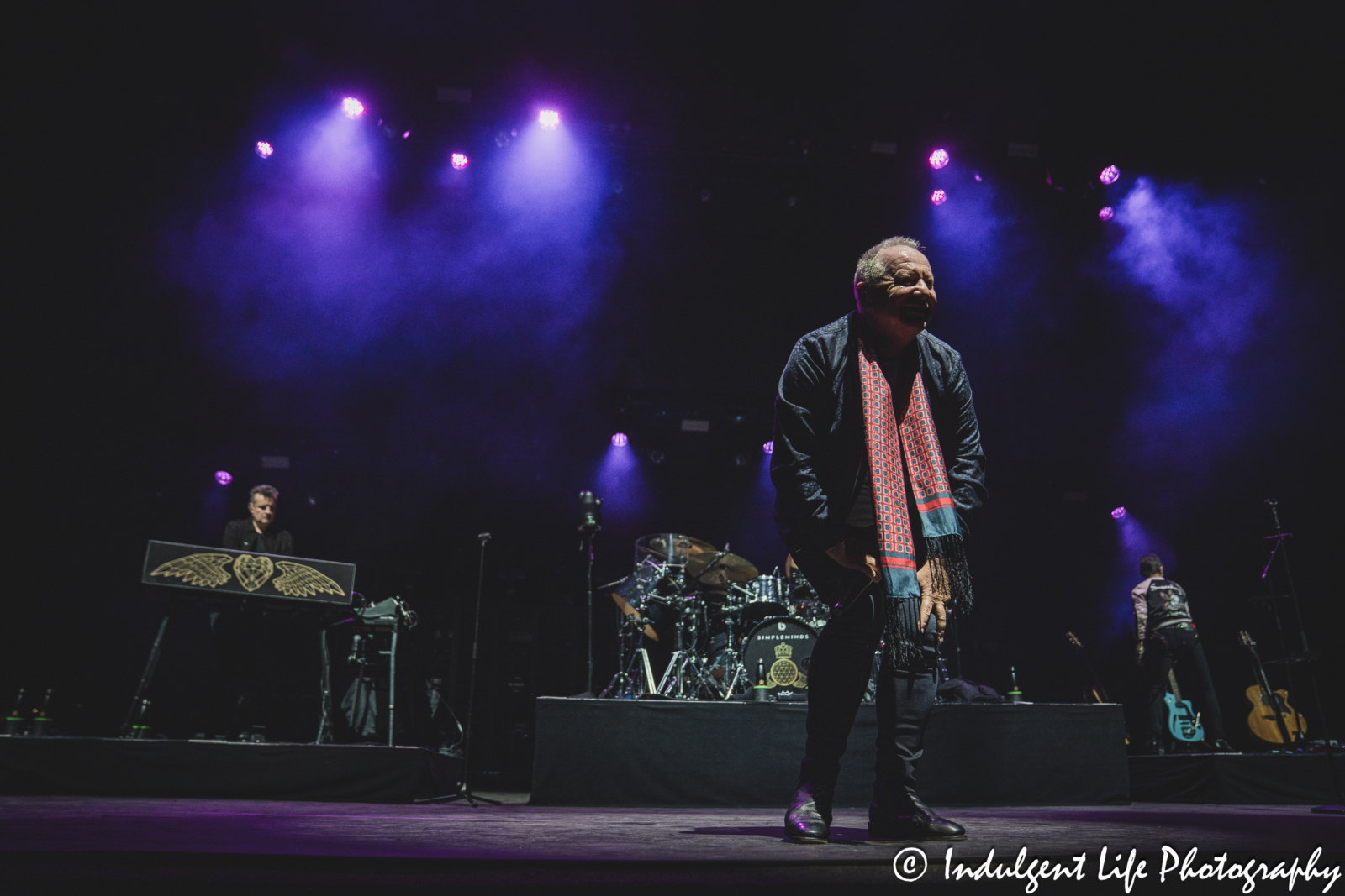Lead singer Jim Kerr performing "Glittering Prize" live in concert with his band Simple Minds on their "Alive & Kicking" tour at Hollywood Casino Amphitheater in Maryland Heights, MO on June 5, 2025.