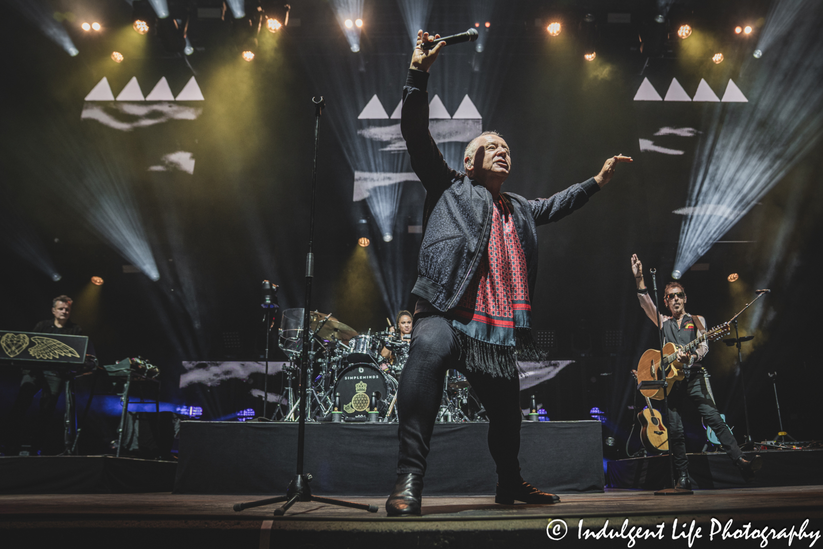 Simple Minds frontman Jim Kerr performing "Waterfront" live in concert on their "Alive & Kicking" tour at Hollywood Casino Amphitheater in Maryland Heights, MO on June 5, 2025.