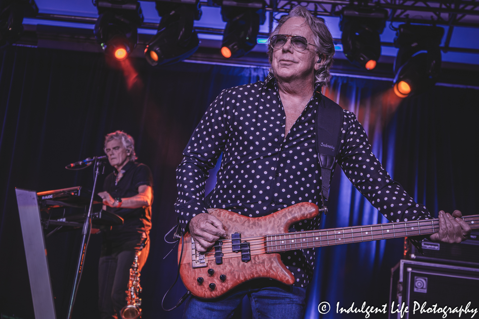 Bass guitar player Ken "Spider" Sinnaeve and keyboardist Doug Johnson of Loverboy performing "Lucky Ones" live in concert at Prairie Band Casino in Mayetta, KS on July 24, 2025.