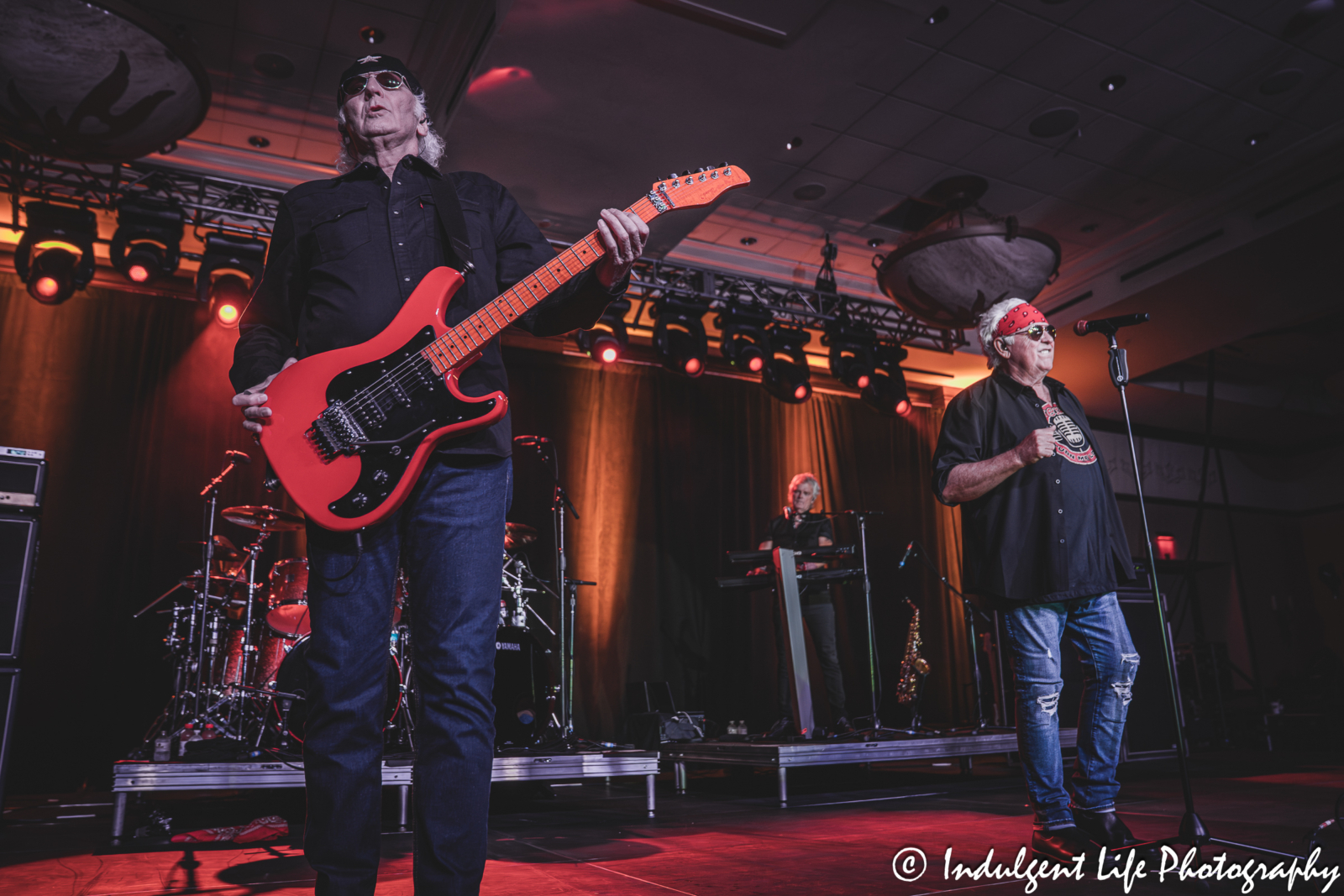 Guitar player Paul Dean and lead singer Mike Reno of Loverboy performing "Queen of the Broken Hearts" with keyboardist Doug Johnson live at Prairie Band Casino in Mayetta, KS on July 24, 2025.