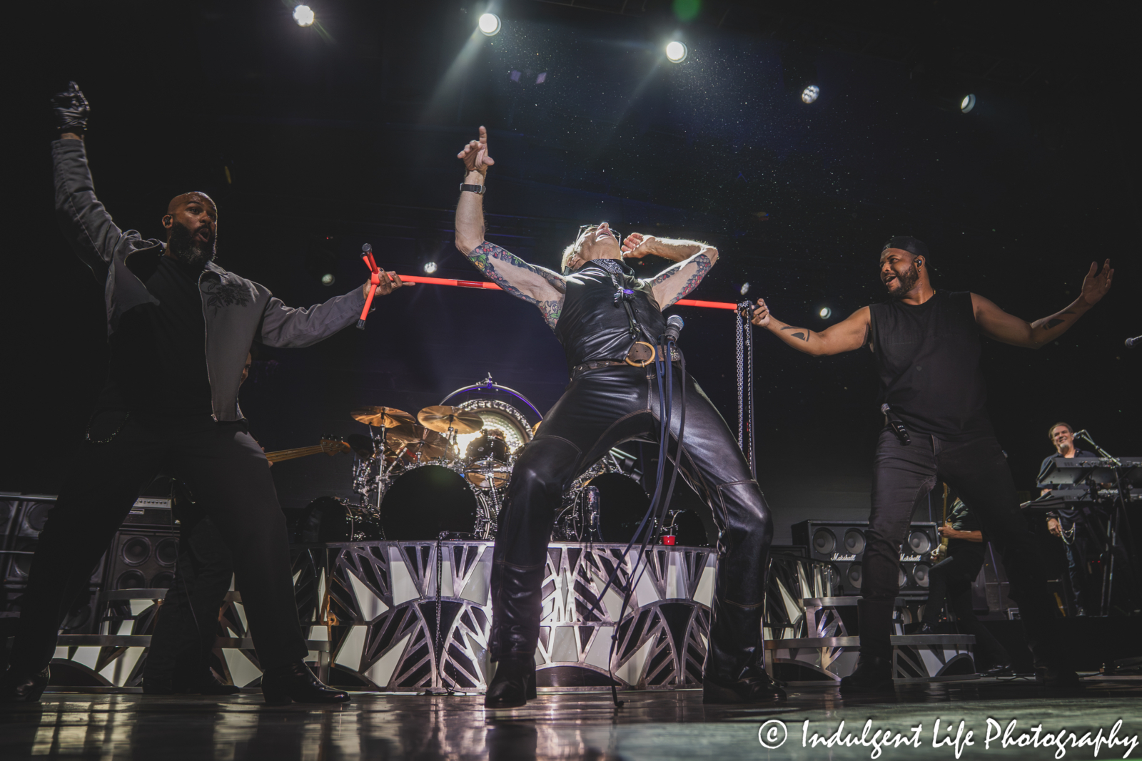 David Lee Roth doing the limbo while performing live in concert Frontman David Lee Roth of Van Halen and his backup singers performing "Drop Dead Legs" live in concert at Grinders in the Crossroads of downtown Kansas City, MO on August 27, 2025.