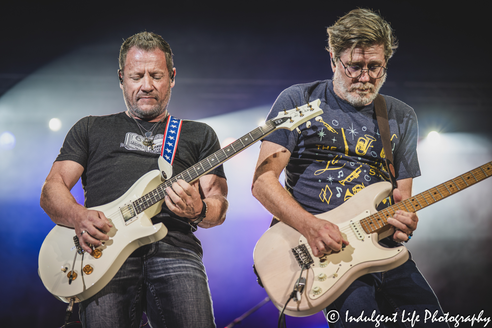 Guitar players Colin Whinnery and Bruce Wallace of Little River Band live in concert performing "Cool Change" together at Azura Amphitheater in Bonner Springs, KS on September 25, 2025.