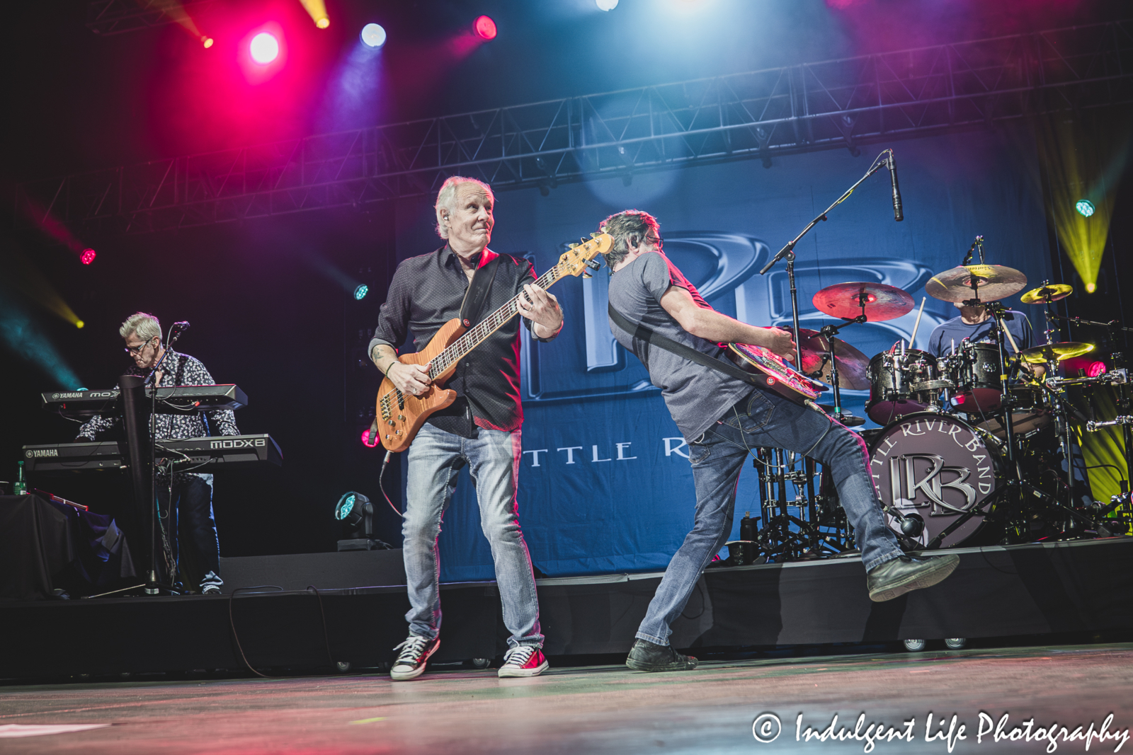 Frontman and bass guitarist Wayne Nelson and Little River Band members performing "Lonesome Loser" live in concert at Three Dog Night band member David Morgan playing the acoustic guitar live at Azura Amphitheater in Bonner Springs, KS on September 25, 2025.
