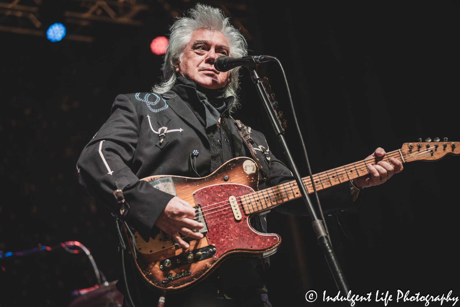 Marty Stuart singing and playing the guitar live at Star Pavilion inside of Ameristar Casino in Kansas City, MO on September 19, 2025.