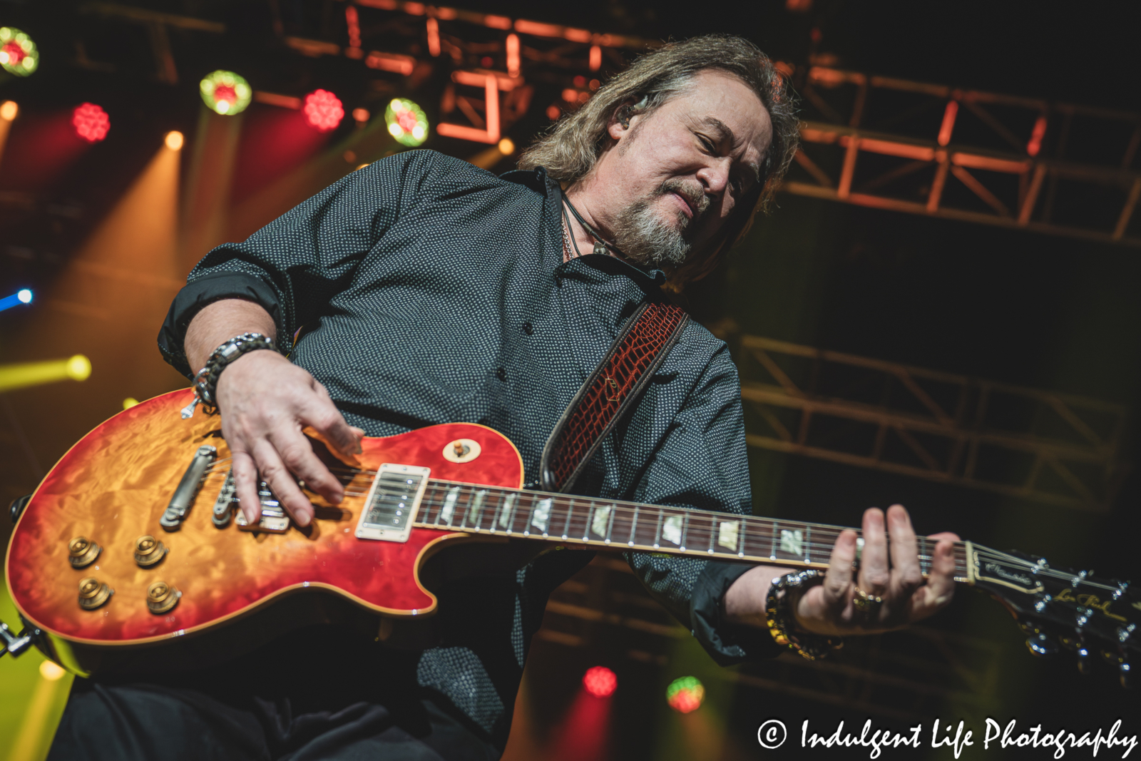 Travis Tritt playing the guitar while performing "Put Some Drive in Your Country" live at Star Pavilion inside of Ameristar Casino in Kansas City, MO on October 18, 2025.