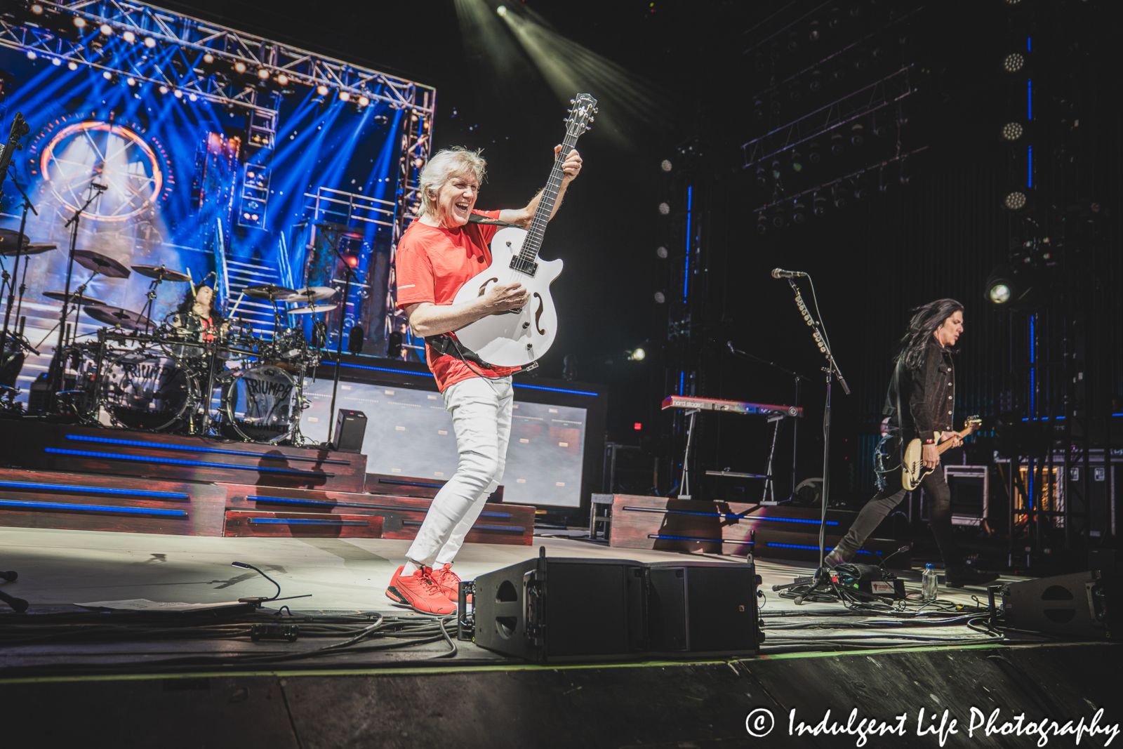 Triumph frontman Rik Emmett performing "When the Lights Go Down" with band members Brent Fitz and Todd Kerns at Starlight Theatre in Kansas City, MO on May 16, 2026.