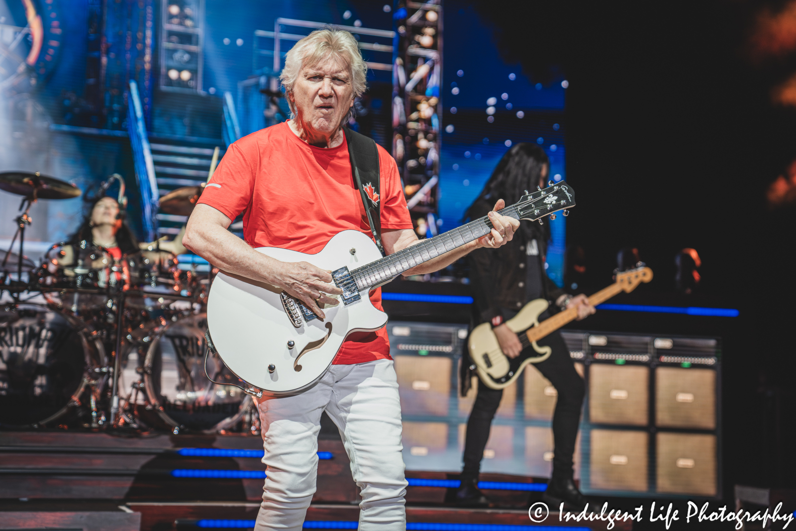 Lead singer Rik Emmett of Triumph performing "When the Lights Go Down" with band members Brent Fitz and Todd Kerns at Starlight Theatre in Kansas City, MO on May 16, 2026.