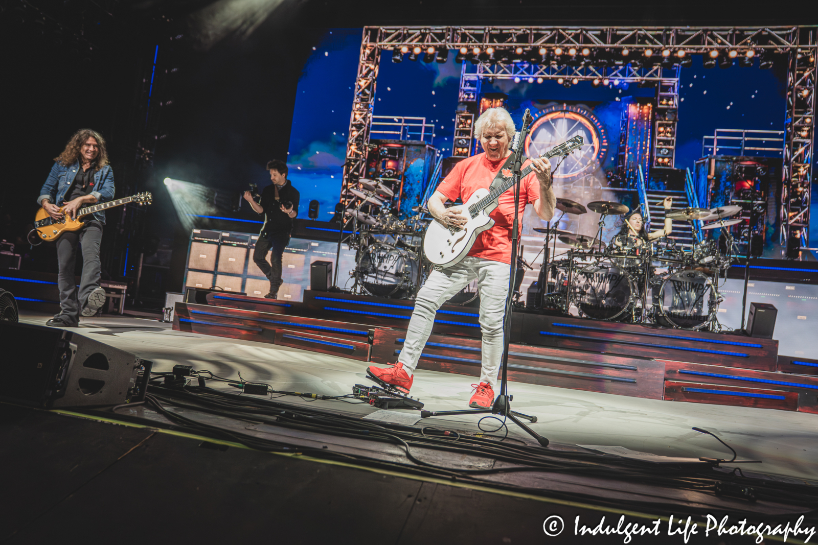 Triumph frontman Rik Emmett performing "When the Lights Go Down" with band members Phil X and Brent Fitz at Starlight Theatre in Kansas City, MO on May 16, 2026.